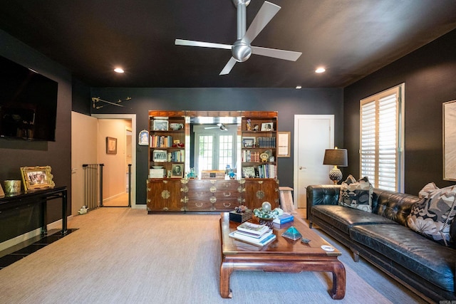 carpeted living area with radiator, baseboards, a ceiling fan, and recessed lighting