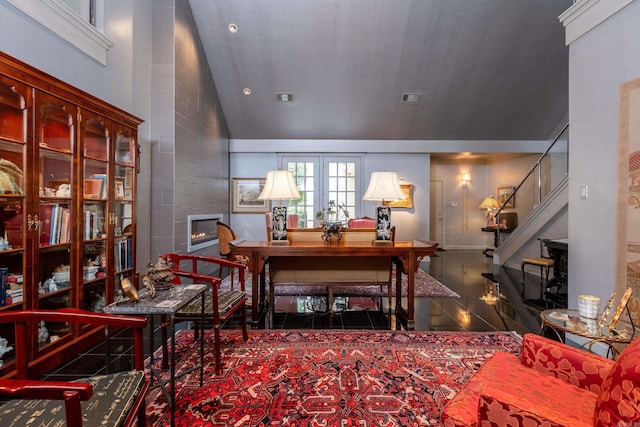 interior space with lofted ceiling, visible vents, stairway, and tile patterned floors