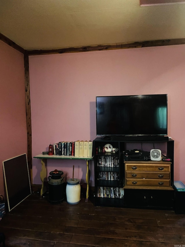 bedroom with crown molding and dark hardwood / wood-style flooring