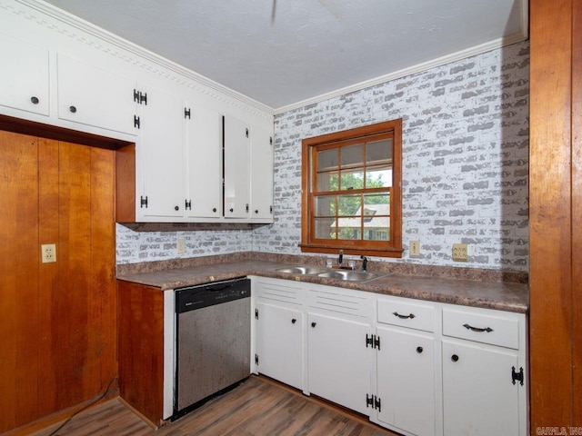 kitchen with sink, dark hardwood / wood-style flooring, stainless steel dishwasher, crown molding, and white cabinets