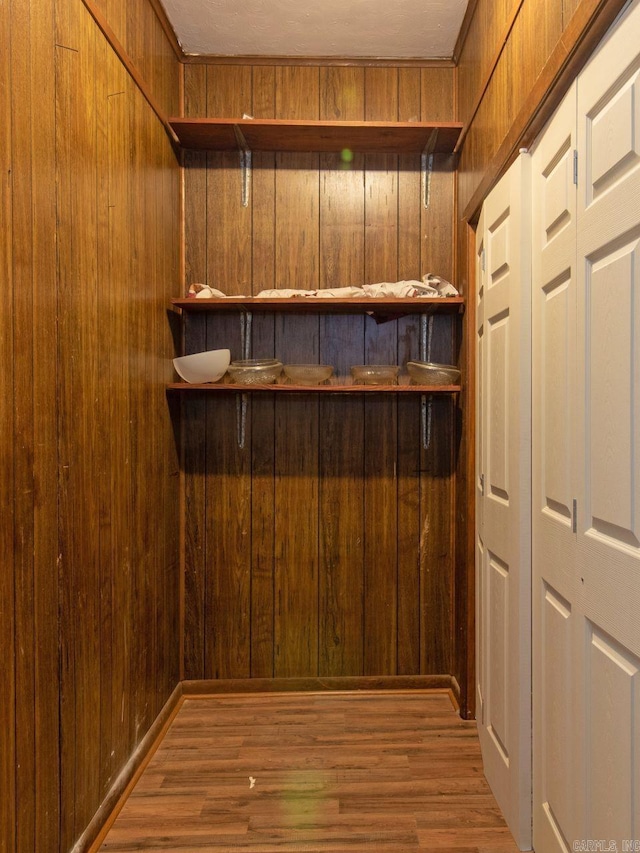 spacious closet featuring light hardwood / wood-style floors