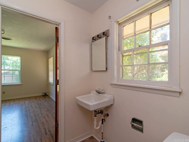 bathroom with hardwood / wood-style floors and sink