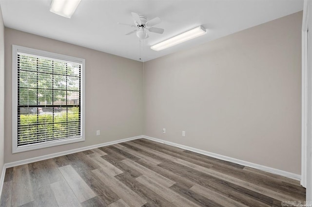 empty room featuring ceiling fan and hardwood / wood-style flooring