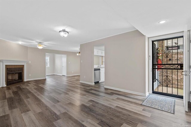 unfurnished living room with hardwood / wood-style floors and plenty of natural light