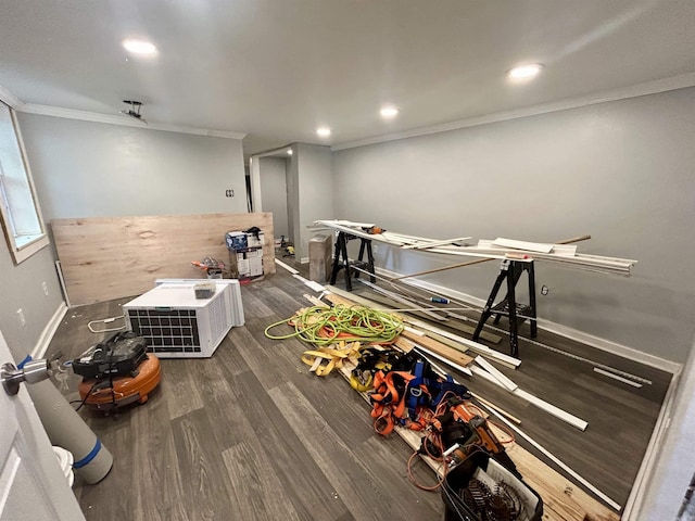 game room with crown molding and dark hardwood / wood-style floors