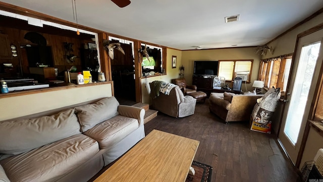 living room featuring dark hardwood / wood-style floors and ceiling fan