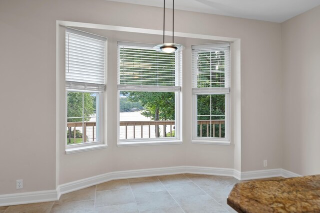 unfurnished dining area with light tile floors