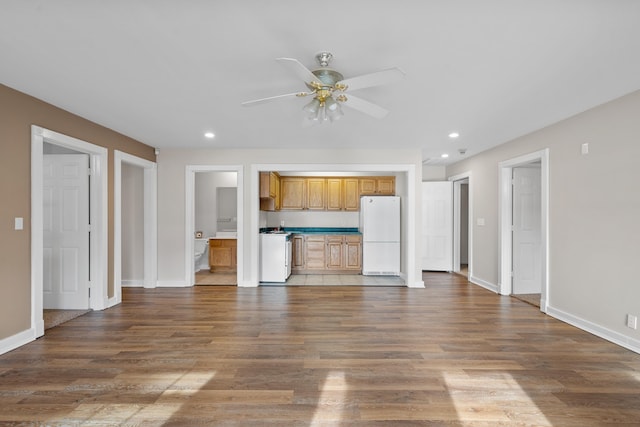 unfurnished living room featuring wood-type flooring and ceiling fan