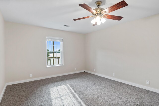 spare room with carpet flooring and ceiling fan