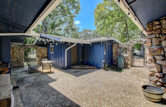 exterior space featuring a gate