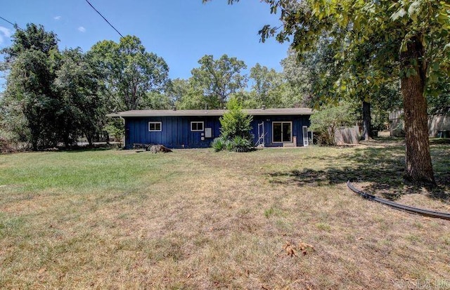 view of front of home featuring a front lawn and board and batten siding