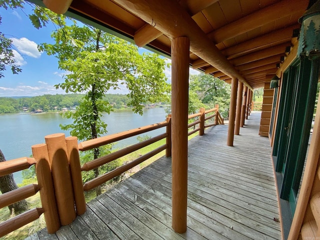 wooden deck featuring a water view