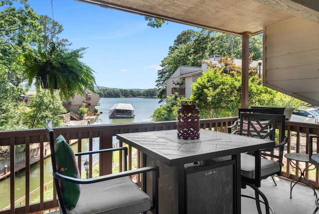 wooden terrace with a water view