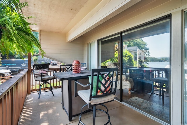 balcony featuring a water view