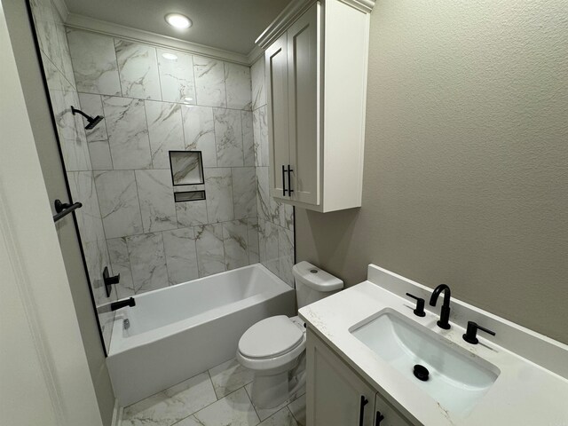 full bathroom with vanity, ornamental molding, tiled shower / bath combo, and toilet