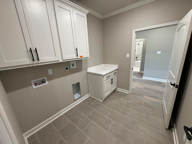 washroom featuring washer hookup, electric dryer hookup, cabinets, and crown molding