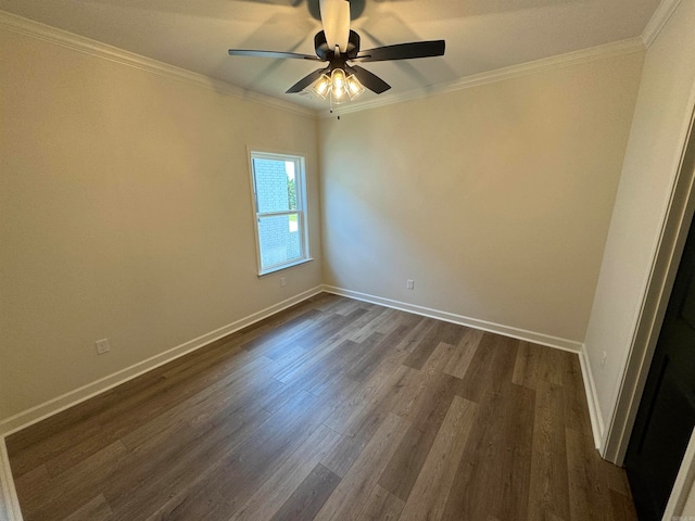 spare room with crown molding, ceiling fan, and dark hardwood / wood-style flooring