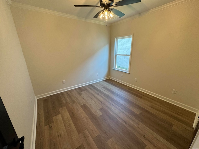 spare room with ceiling fan, ornamental molding, and dark hardwood / wood-style flooring