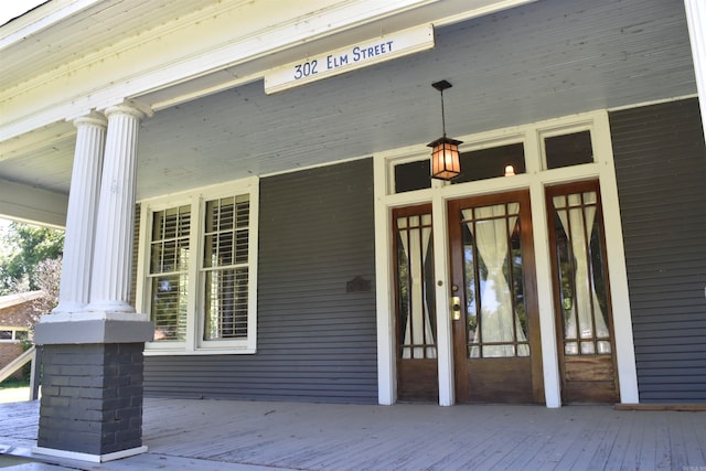 doorway to property with a porch