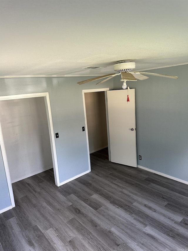 empty room with dark wood-type flooring