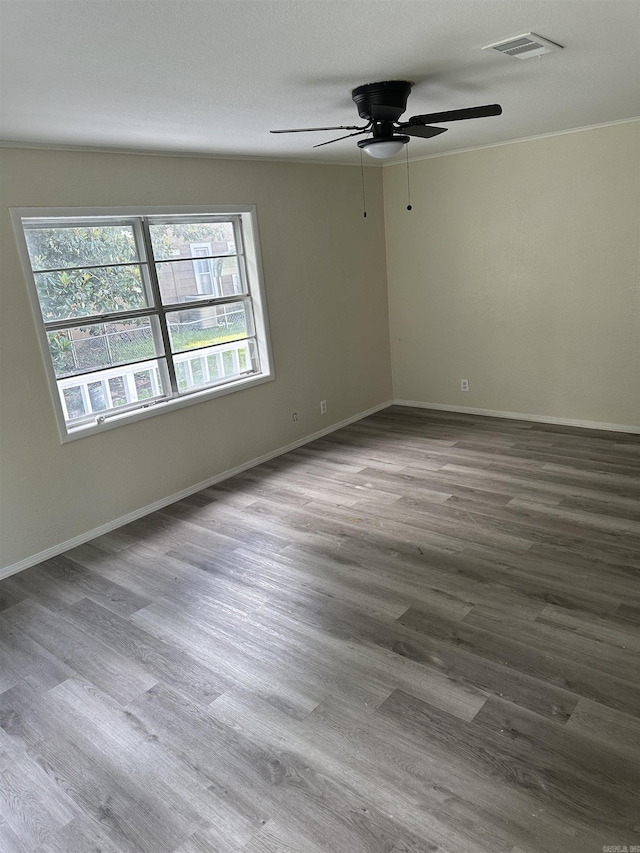 unfurnished room featuring hardwood / wood-style flooring and ceiling fan