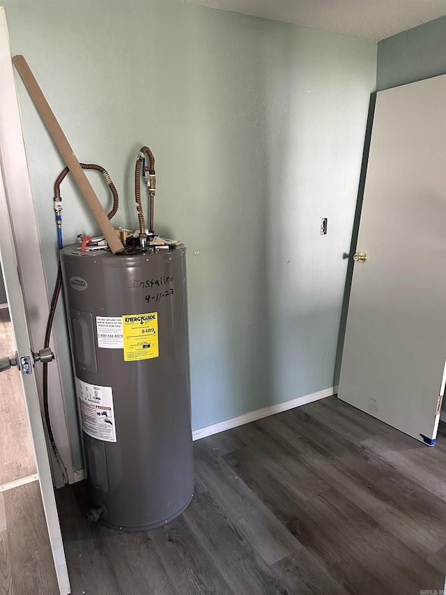 utility room featuring water heater