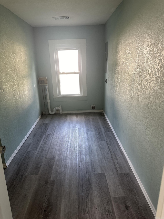 empty room featuring dark hardwood / wood-style flooring