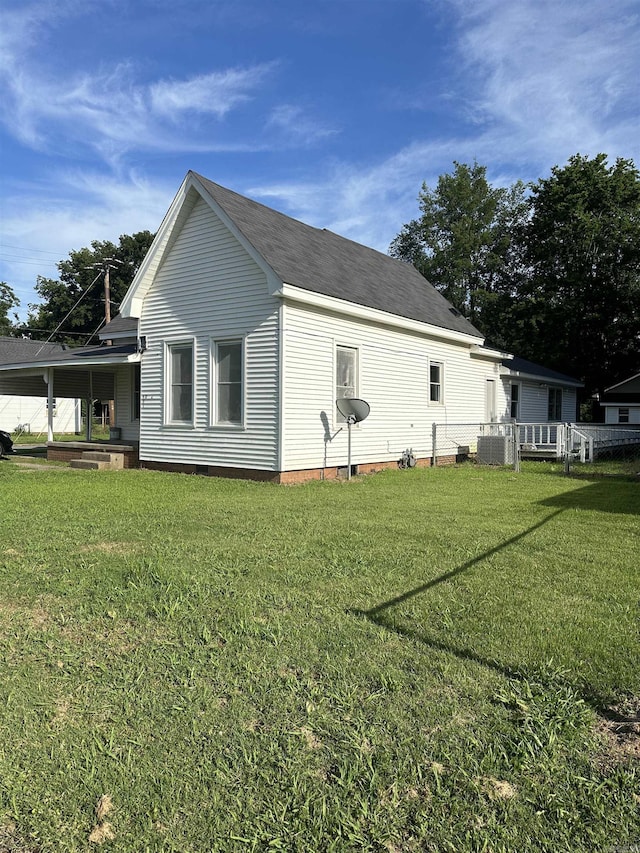 view of property exterior featuring a yard and cooling unit