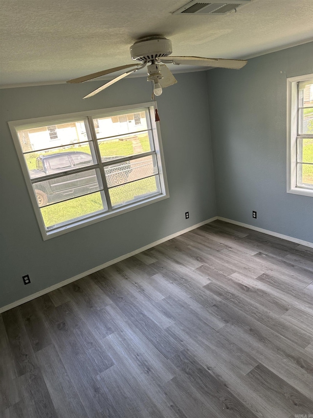 unfurnished room with hardwood / wood-style floors, a textured ceiling, and ceiling fan