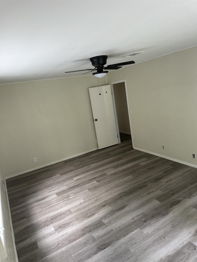 unfurnished room with hardwood / wood-style flooring