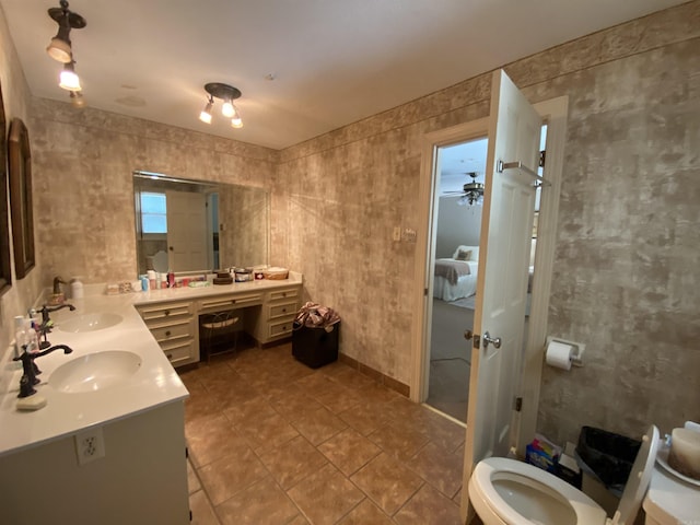 bathroom featuring tile patterned floors, ceiling fan, vanity, and toilet