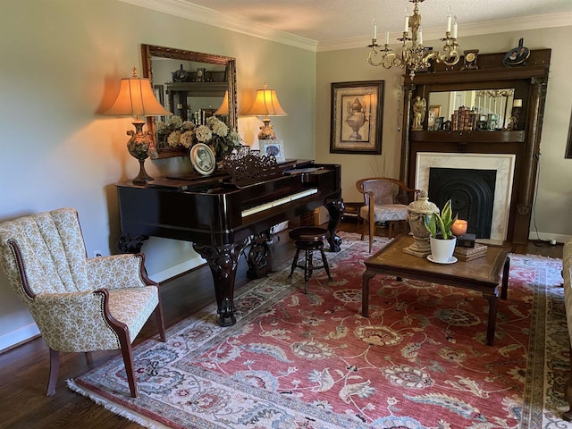 sitting room with a high end fireplace, ornamental molding, a textured ceiling, a notable chandelier, and hardwood / wood-style floors