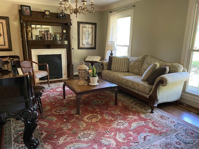 living room featuring hardwood / wood-style floors, a notable chandelier, and ornamental molding