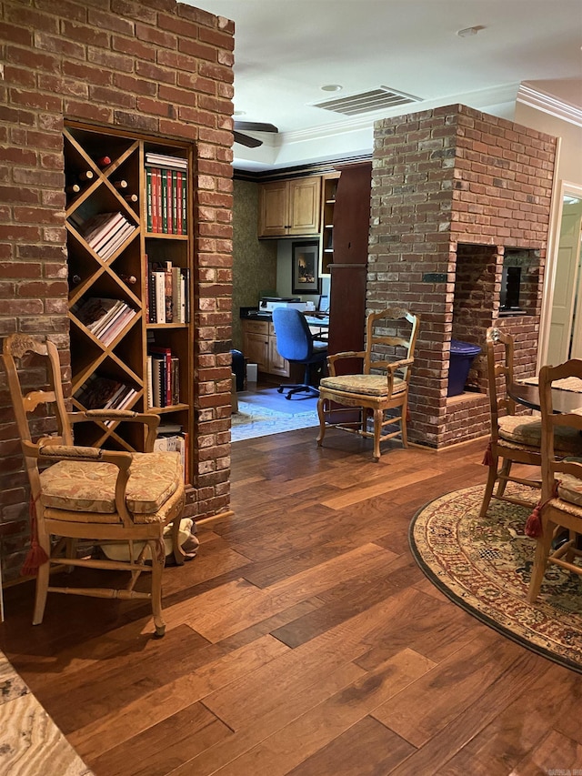 interior space featuring hardwood / wood-style flooring and crown molding