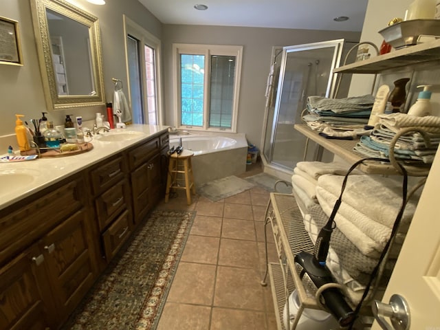 bathroom with separate shower and tub, tile patterned flooring, and vanity