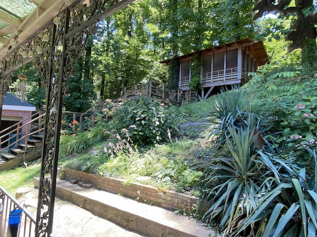 view of yard with a sunroom