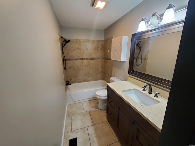 full bathroom featuring tile patterned floors, vanity, toilet, and tiled shower / bath