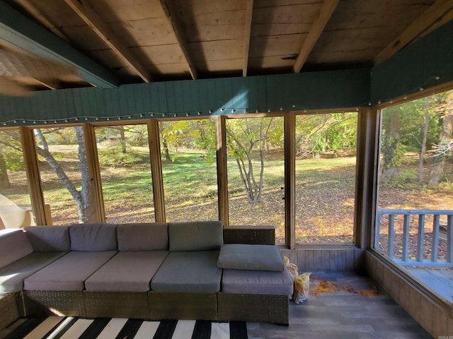 unfurnished sunroom with beam ceiling and wood ceiling