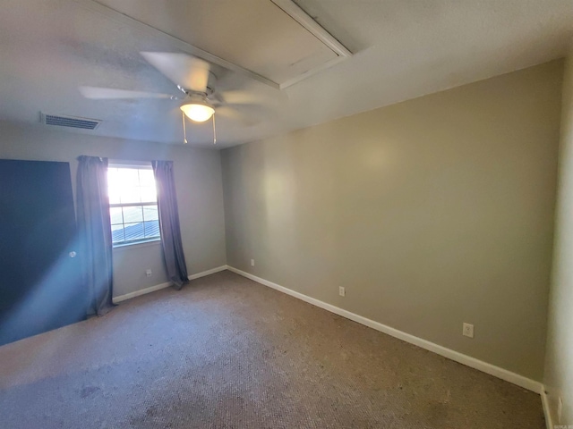 carpeted empty room featuring ceiling fan