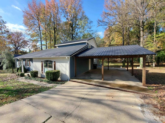 view of side of home featuring a carport