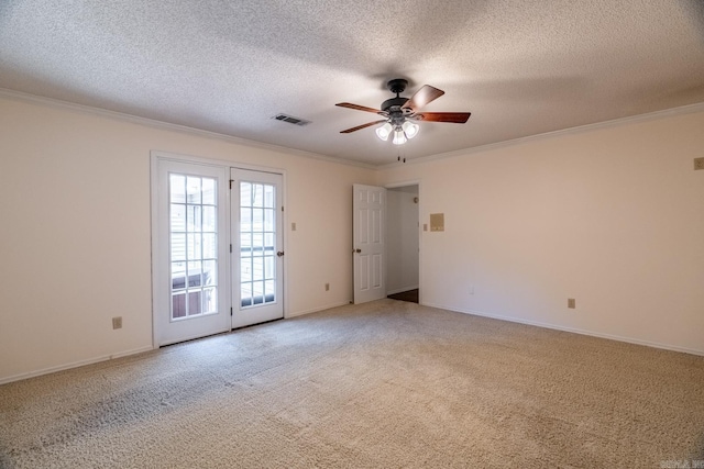 unfurnished room featuring carpet flooring, a textured ceiling, ceiling fan, and ornamental molding