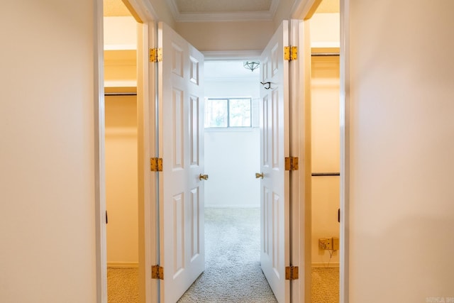 hall with light carpet and crown molding