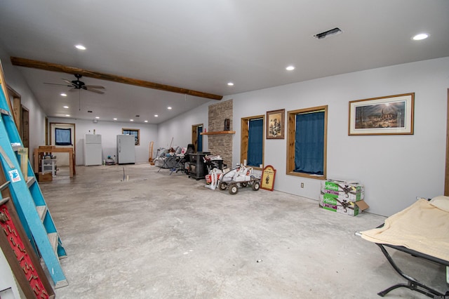 garage featuring ceiling fan and white refrigerator