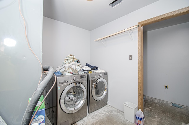 washroom featuring independent washer and dryer