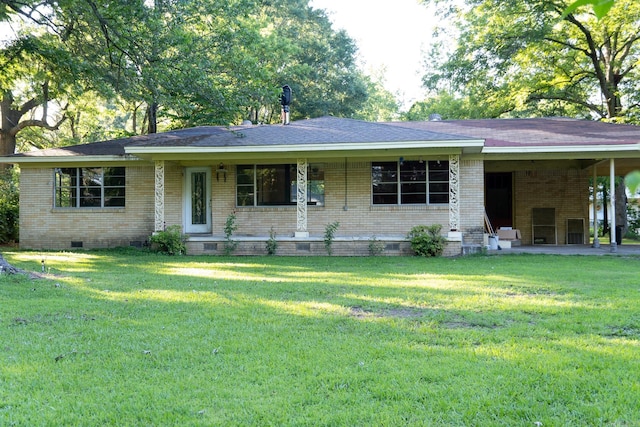 ranch-style home featuring a front yard