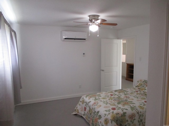 bedroom with an AC wall unit and ceiling fan