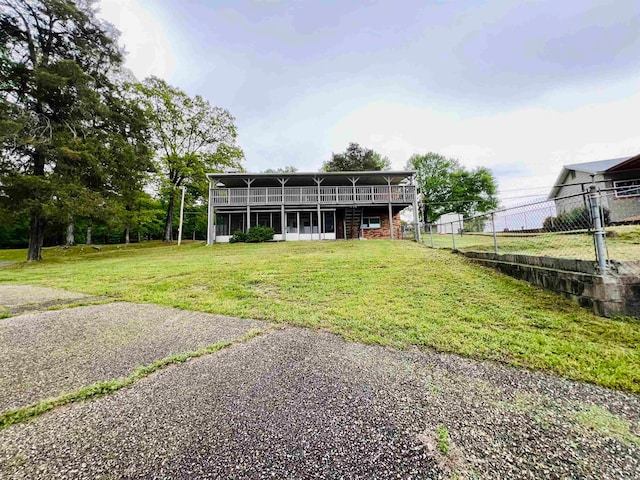 rear view of house with a lawn