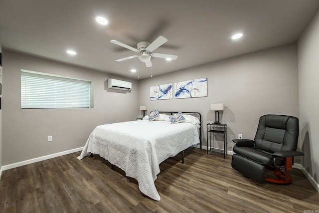 bedroom featuring dark hardwood / wood-style flooring, an AC wall unit, and ceiling fan