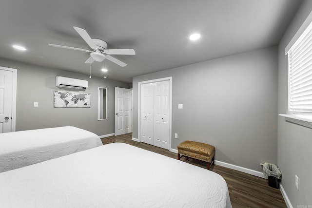 bedroom featuring dark wood-type flooring, an AC wall unit, and ceiling fan