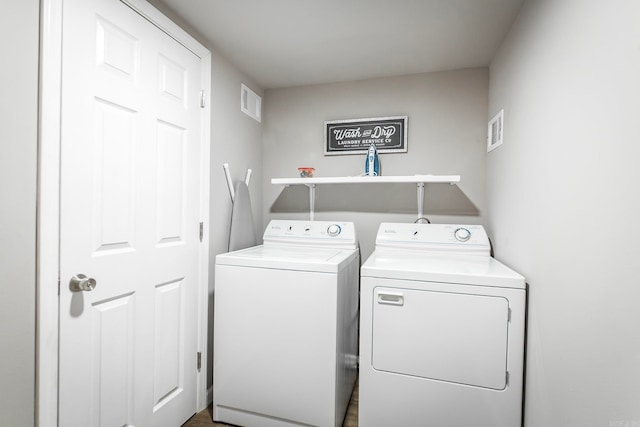 washroom with separate washer and dryer